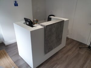 Installed white reception desk for a customer